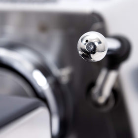 Solid steel housing of the Gaggia machine showcases Italian craftsmanship and durability.
