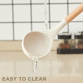 Gaixvny whisk, tongs, and measuring spoons enable versatile prep.