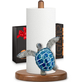 GAJ blue turtle paper towel holder on natural wood base for coastal kitchen decor.
