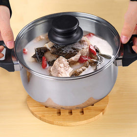 Garkup bamboo round trivet in use demonstrates reliable heat protection.