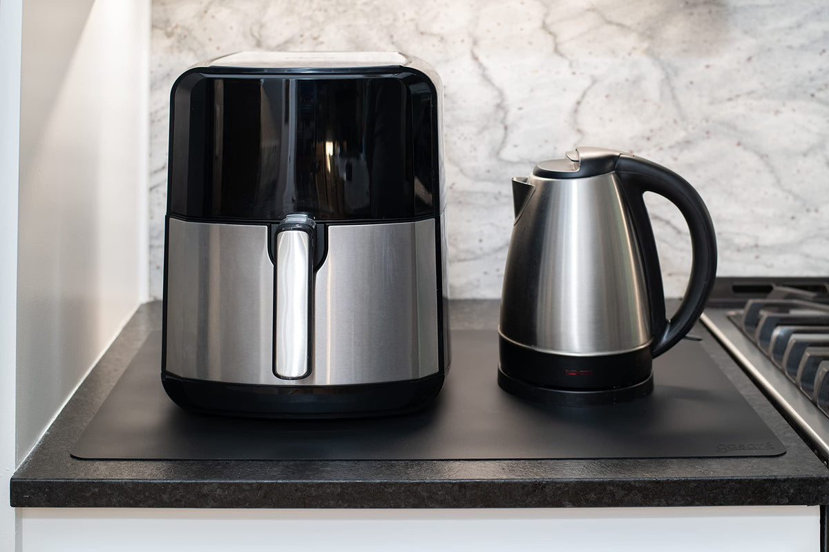 GASARÉ 446°F heat-resistant silicone mats guard countertops from hot cookware.