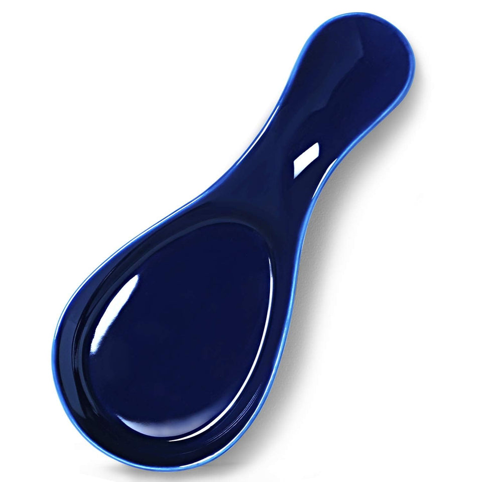 GDCZ porcelain spoon rest in navy, large size catching drips on a kitchen counter