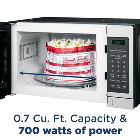 GE countertop microwave control panel emphasizes one-touch Instant On and simple presets.