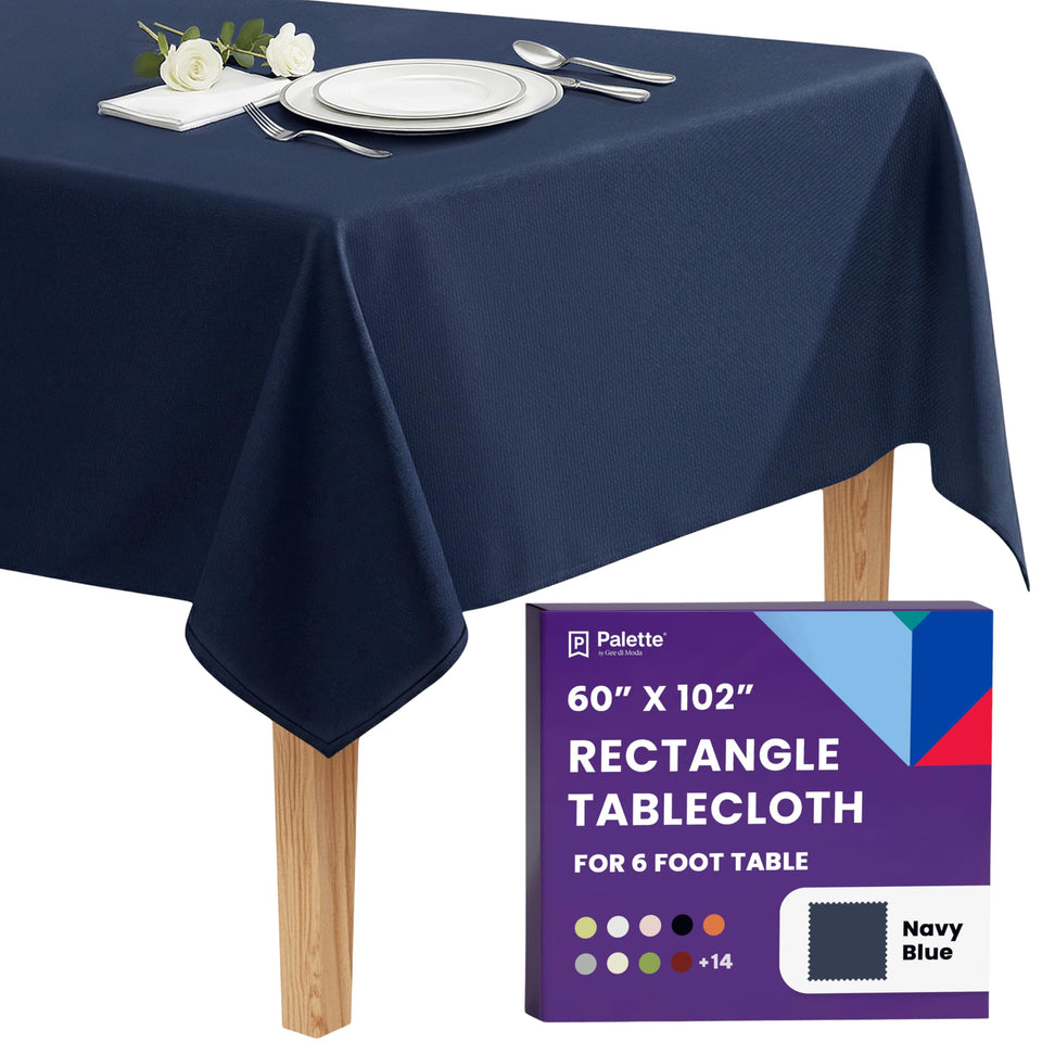 Gee Di Moda rectangle tablecloth on navy table with 15-inch drop for formal dining
