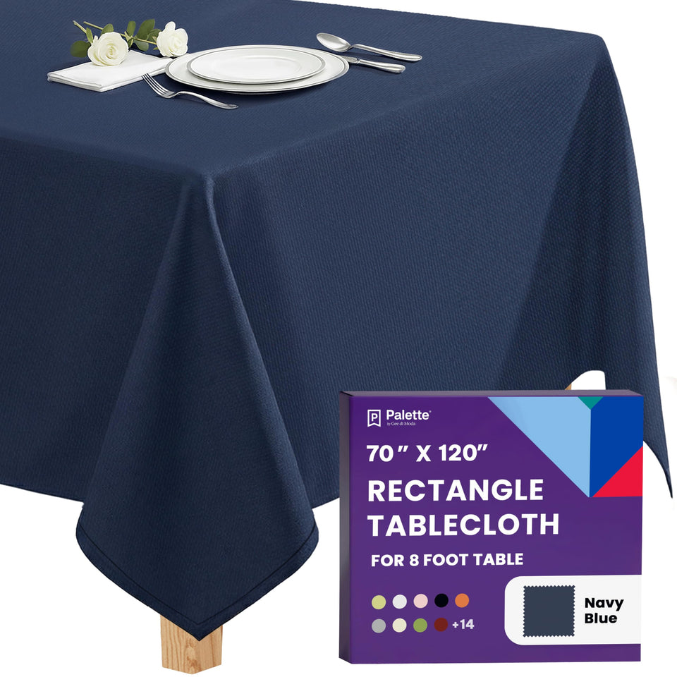 Gee Di Moda rectangle tablecloth on navy blue table for a polished formal dinner