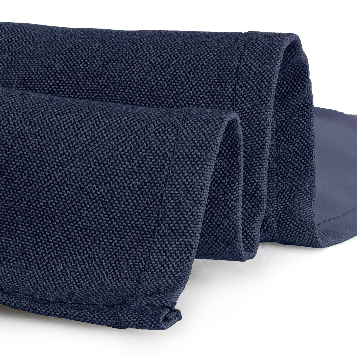 Gee Di Moda washable navy tablecloth demonstrating easy care and color retention