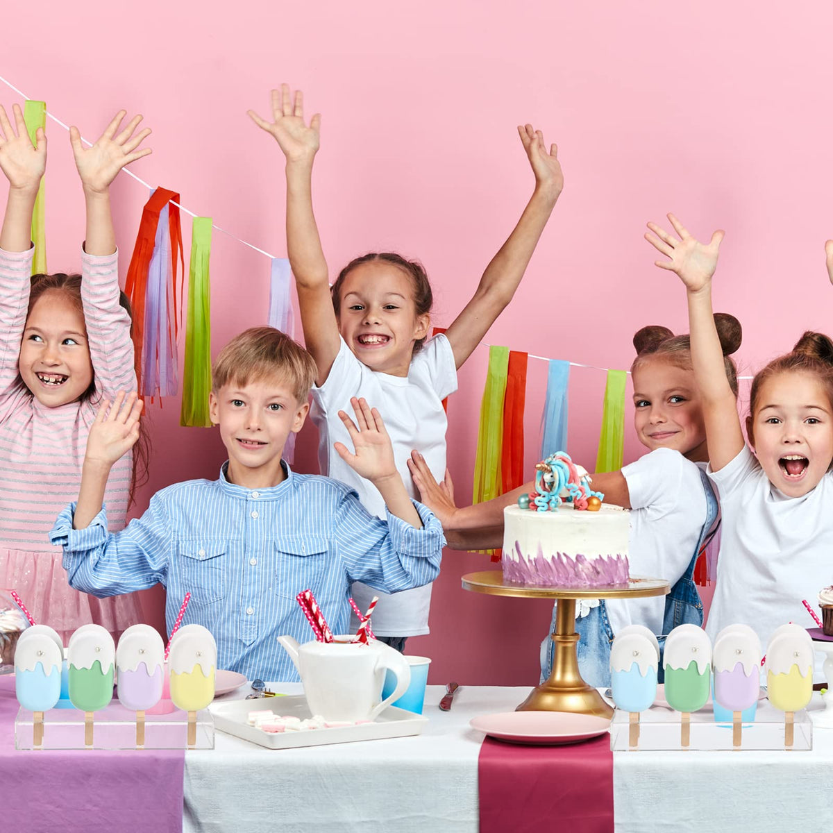 Gejoy dessert table setup adds stylish height to themed parties.