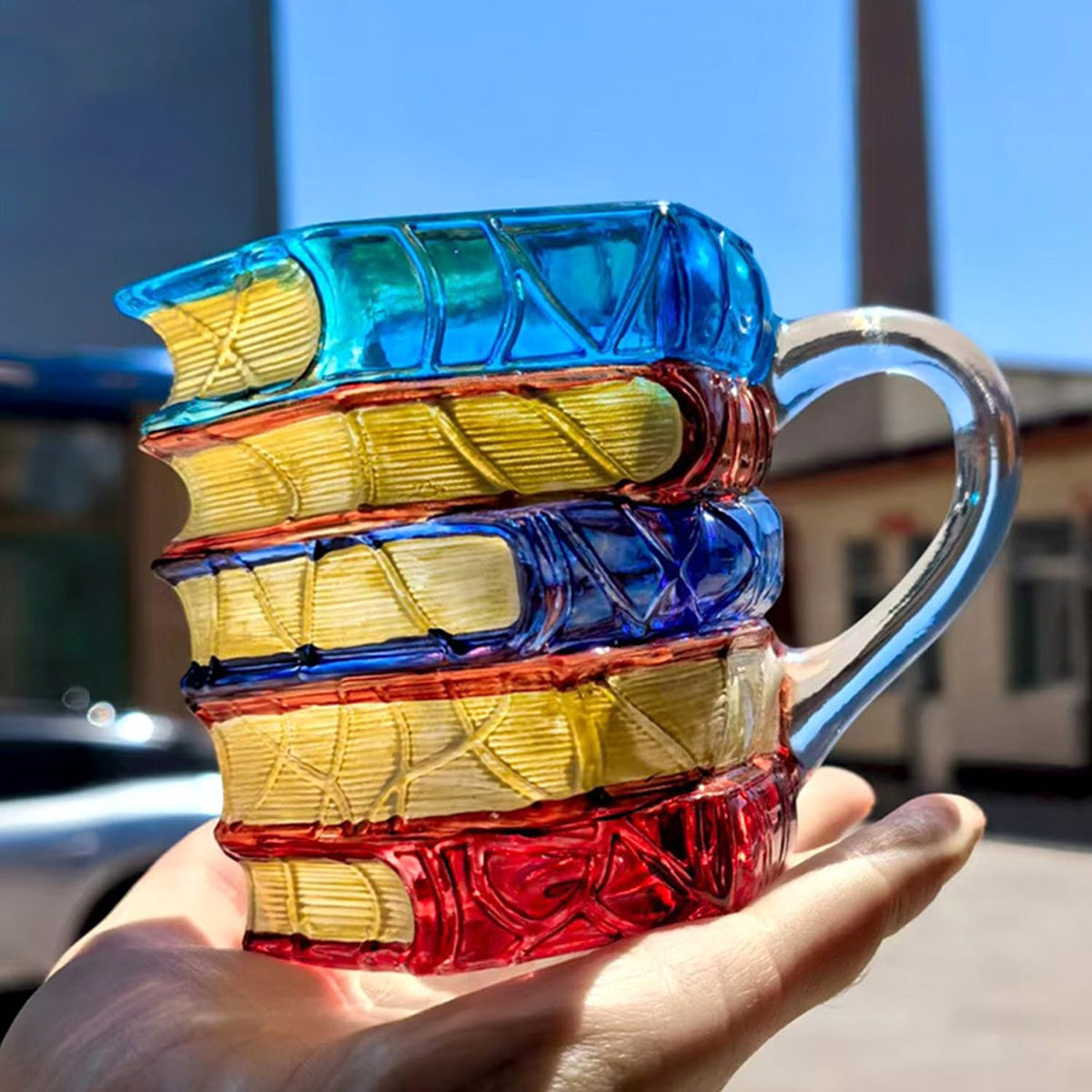 Handmade glass mug with unique painting and craft details.