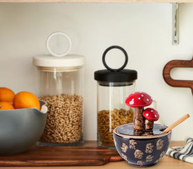 Salt cellar with spices suggests multiple condiment use in kitchen