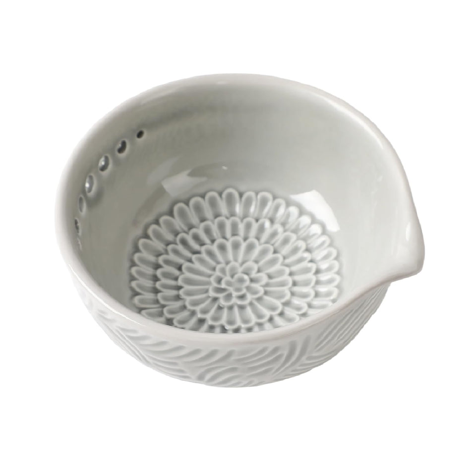 Generic ceramic grater bowl with herb stripper enables quick herb prep and tidy counters.