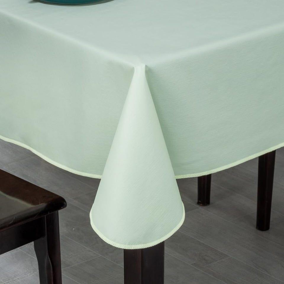 Generic Elegant Rectangular Tablecloth in light green on dining table, stylish and practical.