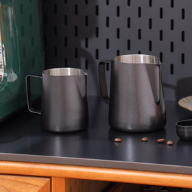 Generic frothing pitcher with internal measurement scale helps portion milk precisely