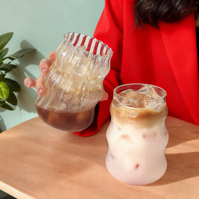 Generic ribbed glass cup 18oz highlights vibrant iced drink hues.