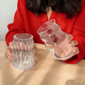 Generic ribbed glass cup 18oz clear design elevates table appeal.