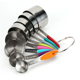 Generic stainless steel measuring cups with close-up markings for precise measurement.