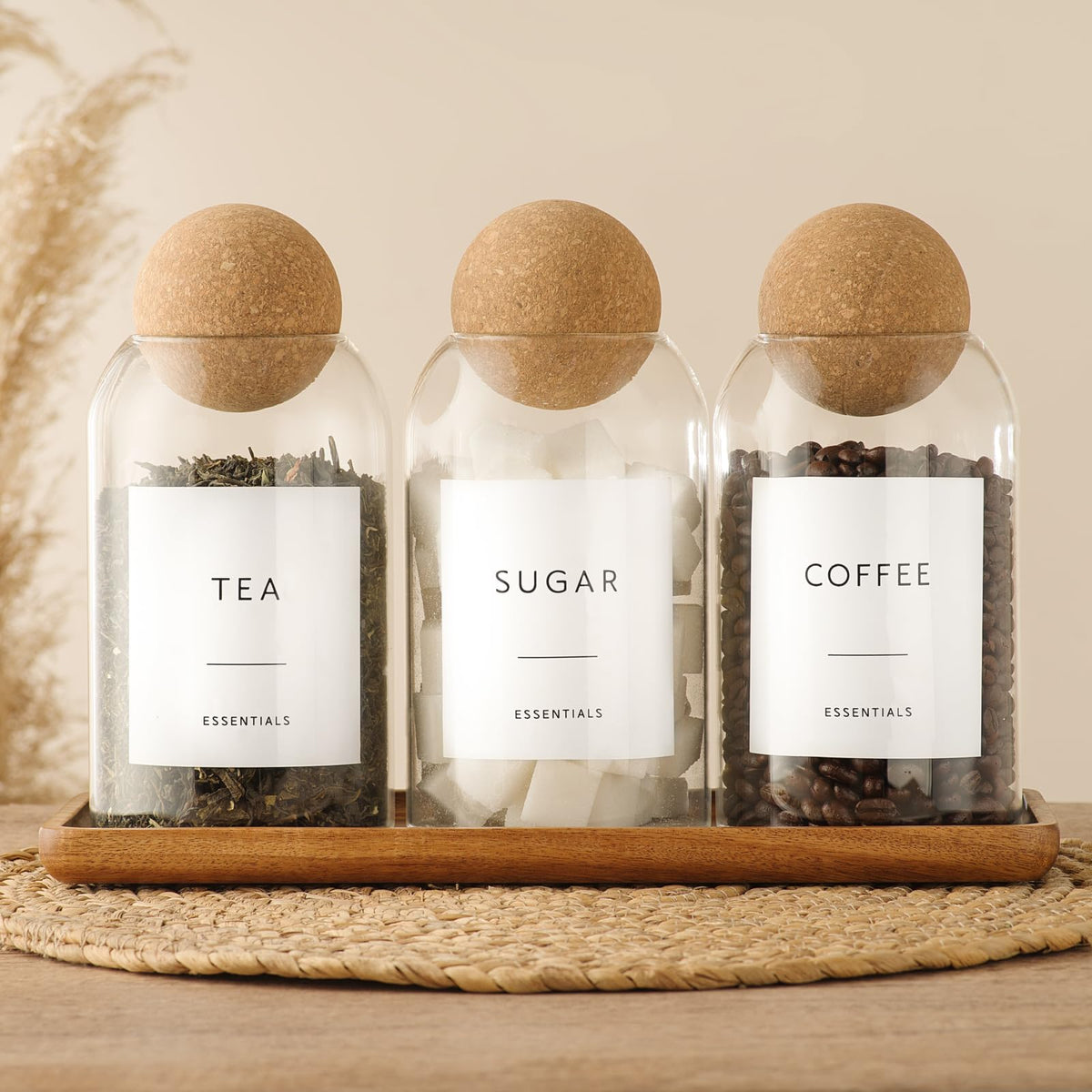 GENSTEUO acacia tray complements glass jars for a tidy kitchen display.