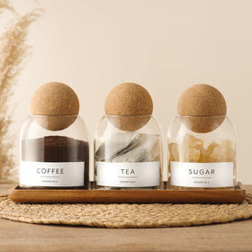 GENSTEUO airtight glass jars with cork lids showing a three-pack setup, ideal for storage.