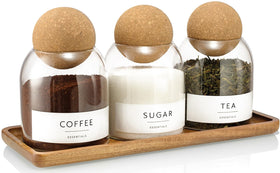 GENSTEUO glass jars with cork lids on an acacia tray for pantry organization.