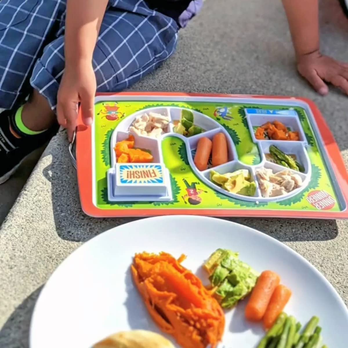 Genuine Fred Dinner Winner supper hero tray encourages balanced portions and dessert surprise.