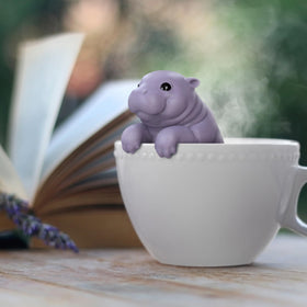 Genuine Fred Sip’opotamus hippo figurine design enhances playful tea moments.