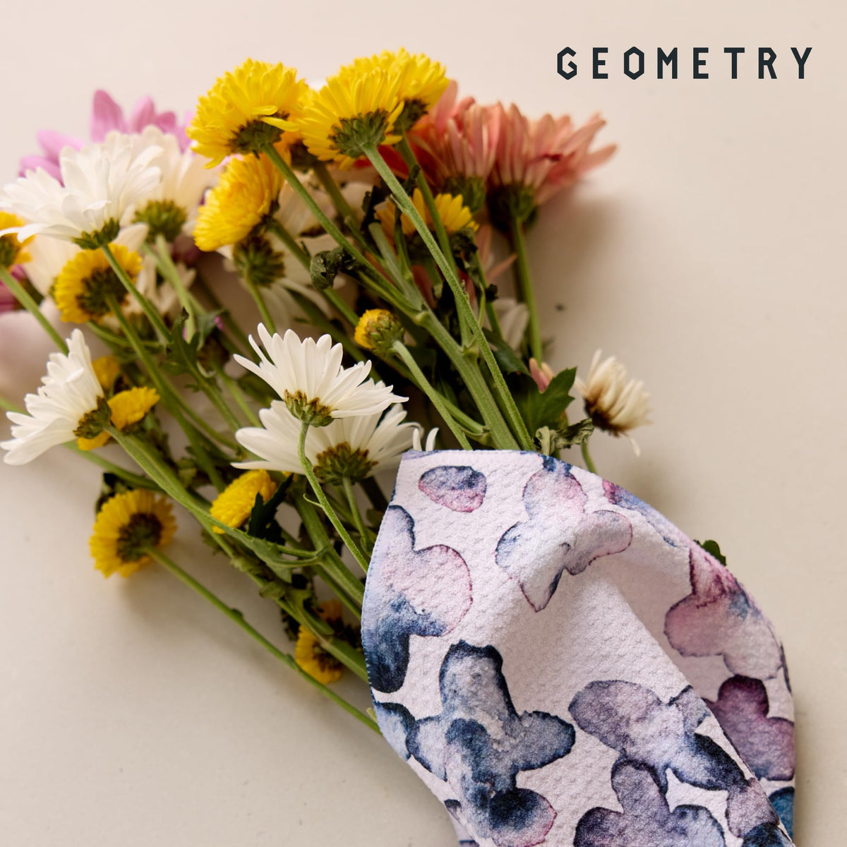 GEOMETRY dishcloth tackling a splash spill for quick cleanup