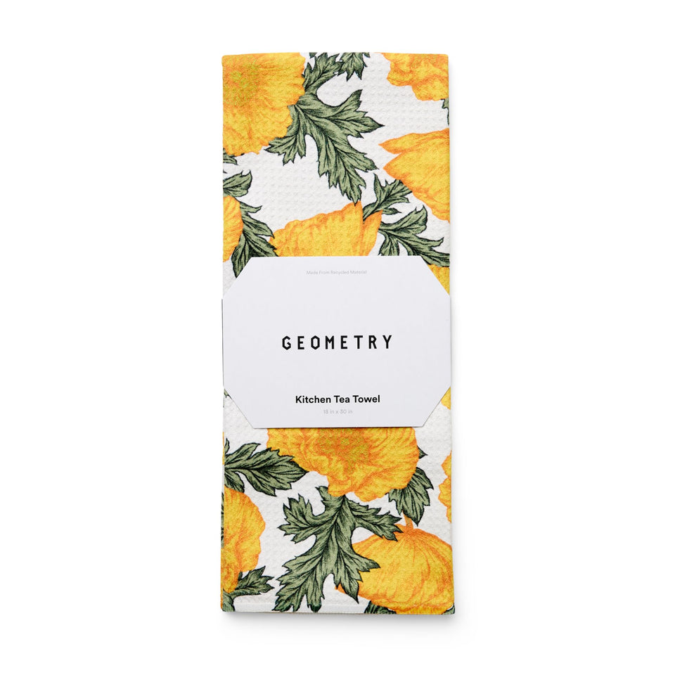 GEOMETRY Field of Gold tea towel folded display shows soft texture for gentle drying.