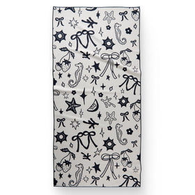 GEOMETRY Micro-Loop Beach Towel on sunlit sand demonstrates quick-dry performance.