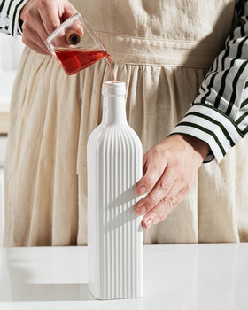 Getstar oil dispenser shown on kitchen counter for stylish practicality.