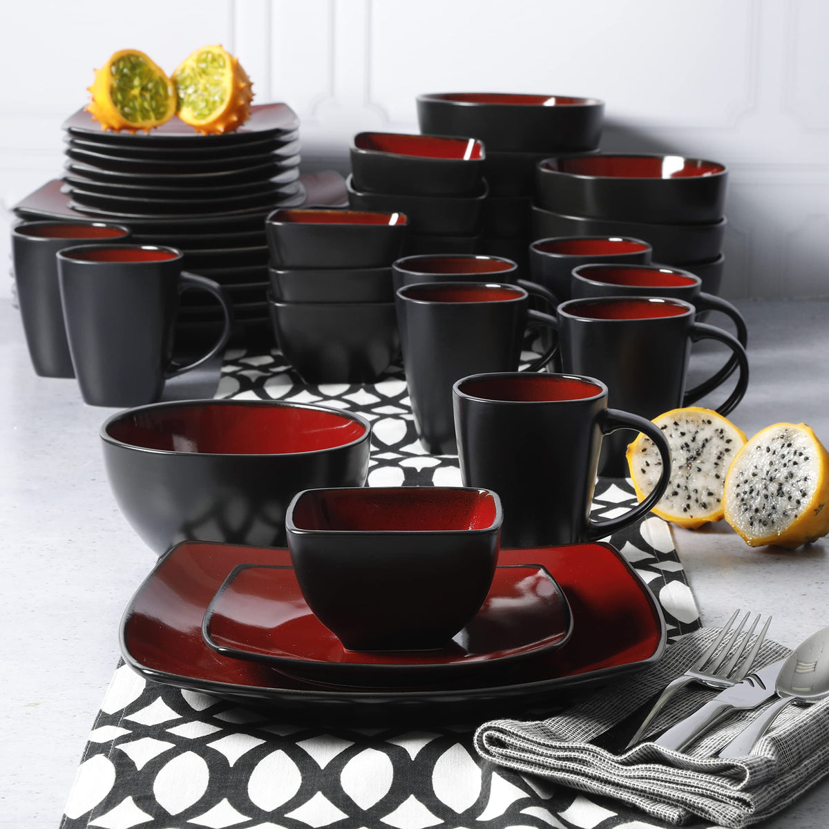 Gibson Elite Soho Lounge square dining setup with cohesive red-black styling.