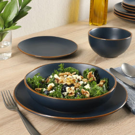 Gibson Home Hazeltine dessert plates in navy glaze with subtle rim.