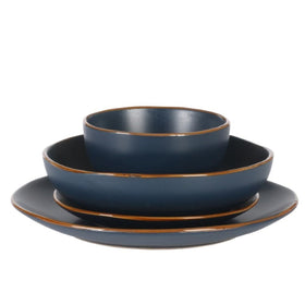 Gibson Home Hazeltine navy tableware pairs with bold color accents.
