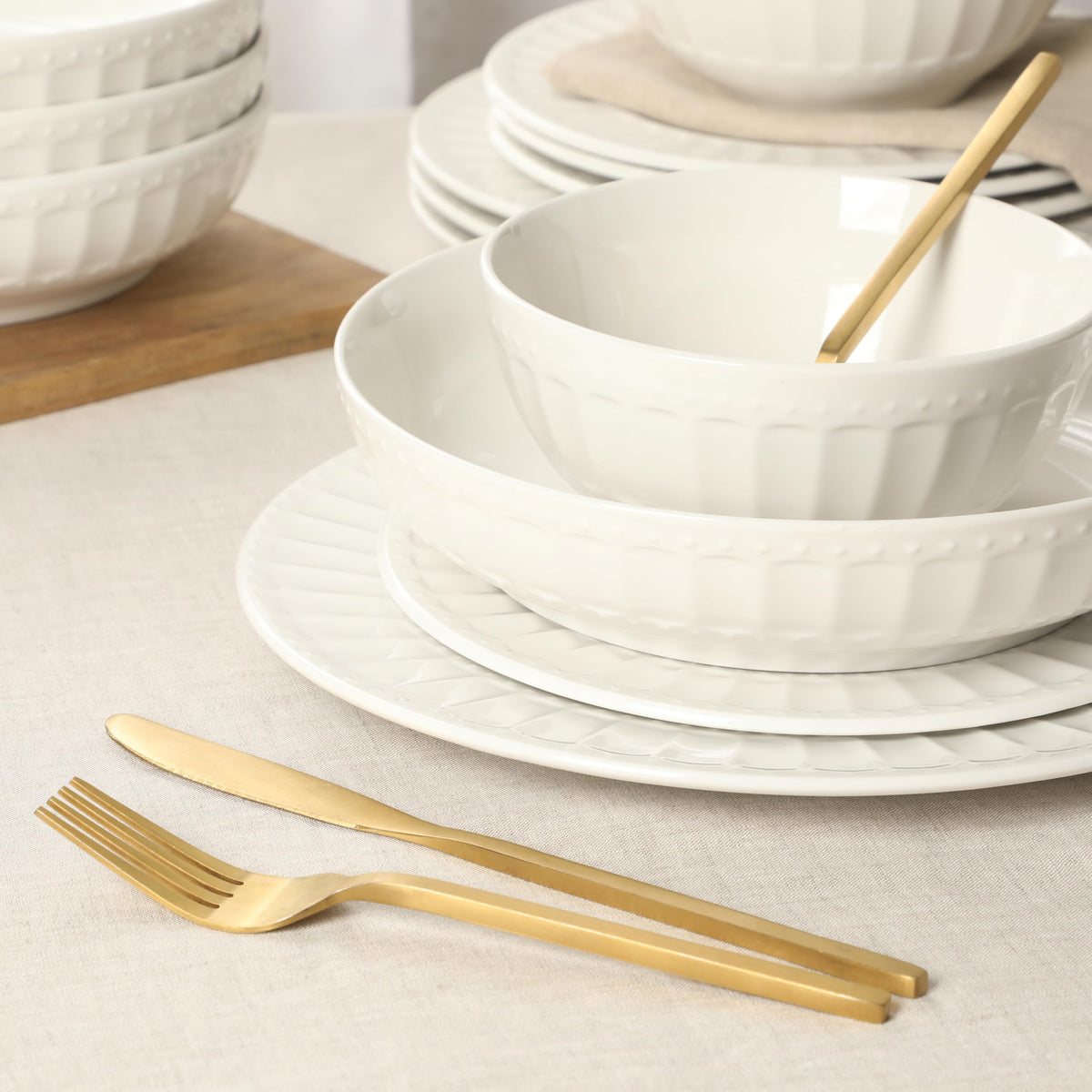 Gibson Home Melbourne white dinner bowls closeup showing durable porcelain texture.