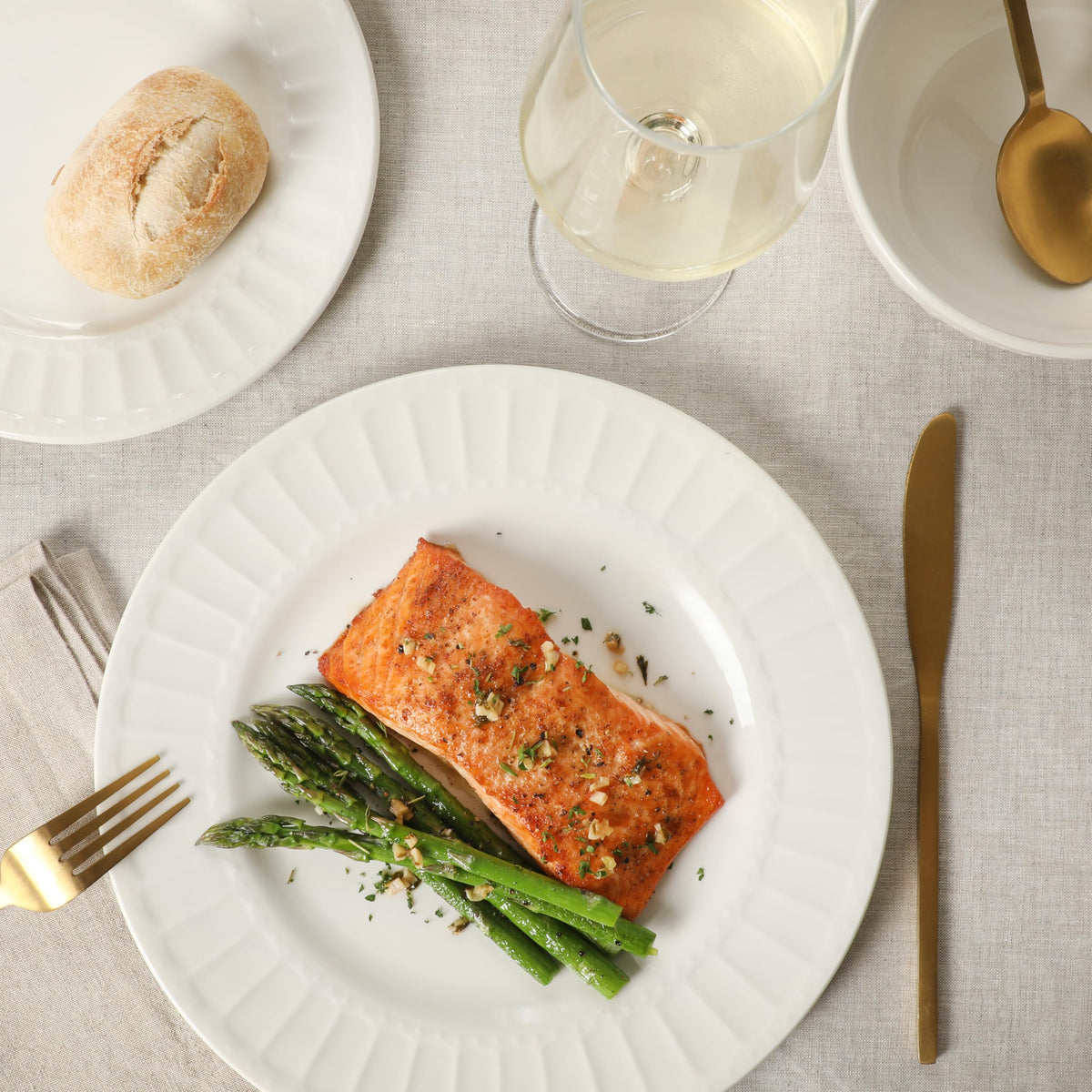 Gibson Home Melbourne white dinner plates scene for versatile daily meals.