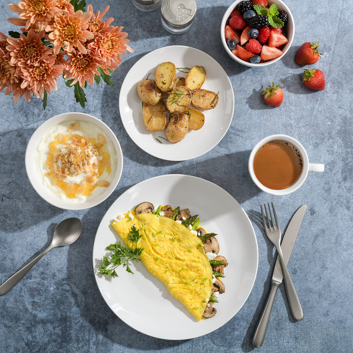 Gibson Home Oslo porcelain plates collection featuring white with a black rim.