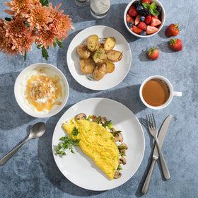 Gibson Home Oslo porcelain plates collection featuring white with a black rim.