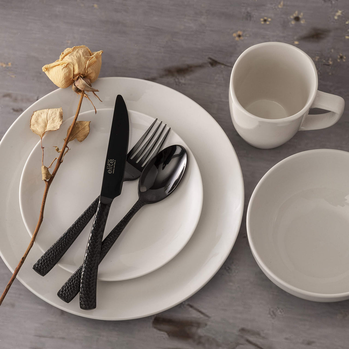 Gibson Home Oslo round coupe design enhances modern table setting.
