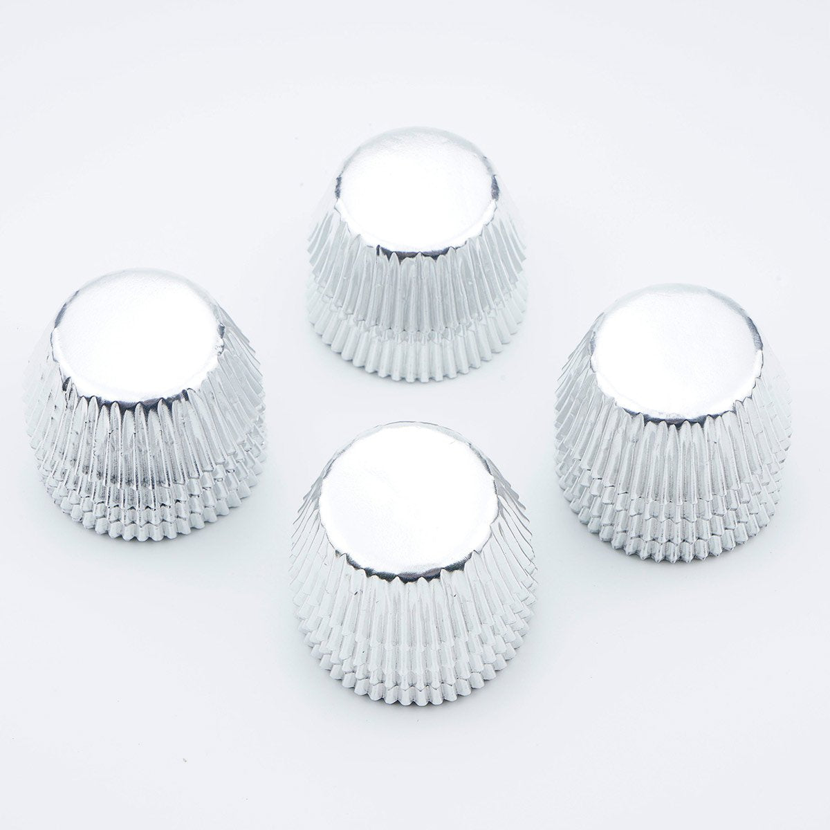 Gifbera mini silver foil cups shine for festive dessert presentation.