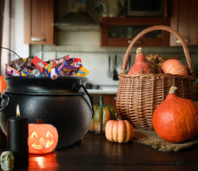 GiftExpress pregnancy announcement cauldron as a playful prop