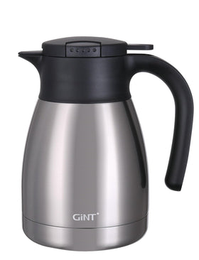 GiNT 34Oz thermal carafe pouring hot coffee with steady flow for entertaining guests.