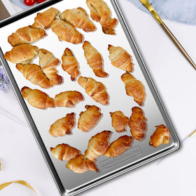 GIUOIDUO baking sheet with full depth contains juices and spills.