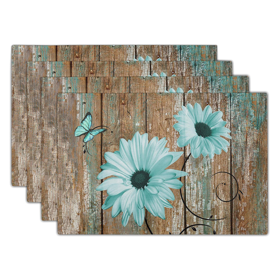 Giwawa rustic daisy placemats with teal sunflowers on vintage wood protect surfaces during meals.