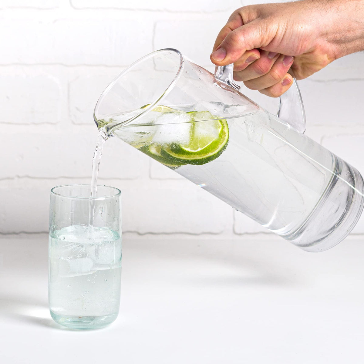 Glaver's glass serving carafe with a sturdy handle for effortless pouring.