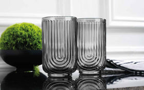 Glaver's tall highball glass shown with layered drinks for serving flair.