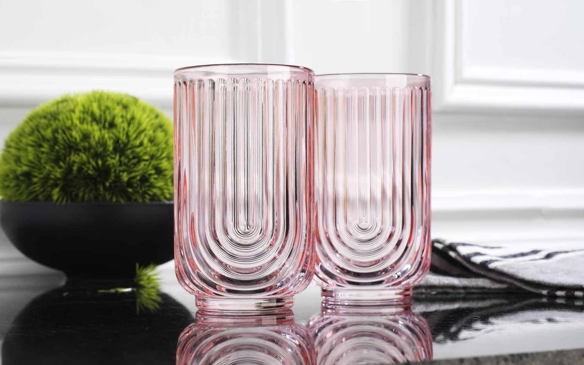 Glaver's pink arch highball glass complements casual dinners with style.