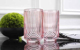 Glaver's pink arch highball glass complements casual dinners with style.