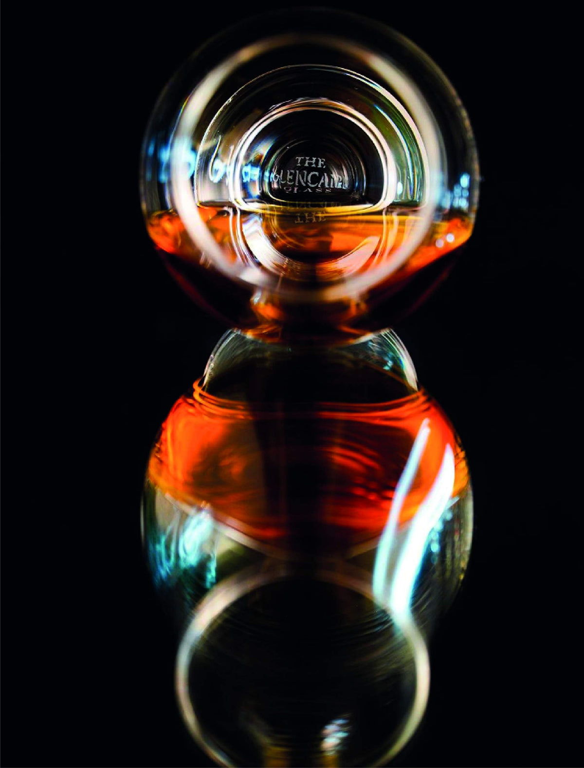 Glencairn whisky glass wide bowl enhances color appreciation and leg visibility for tasting
