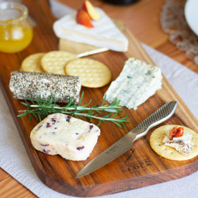 Global 3.5-inch paring knife on cutting board for versatile kitchen prep