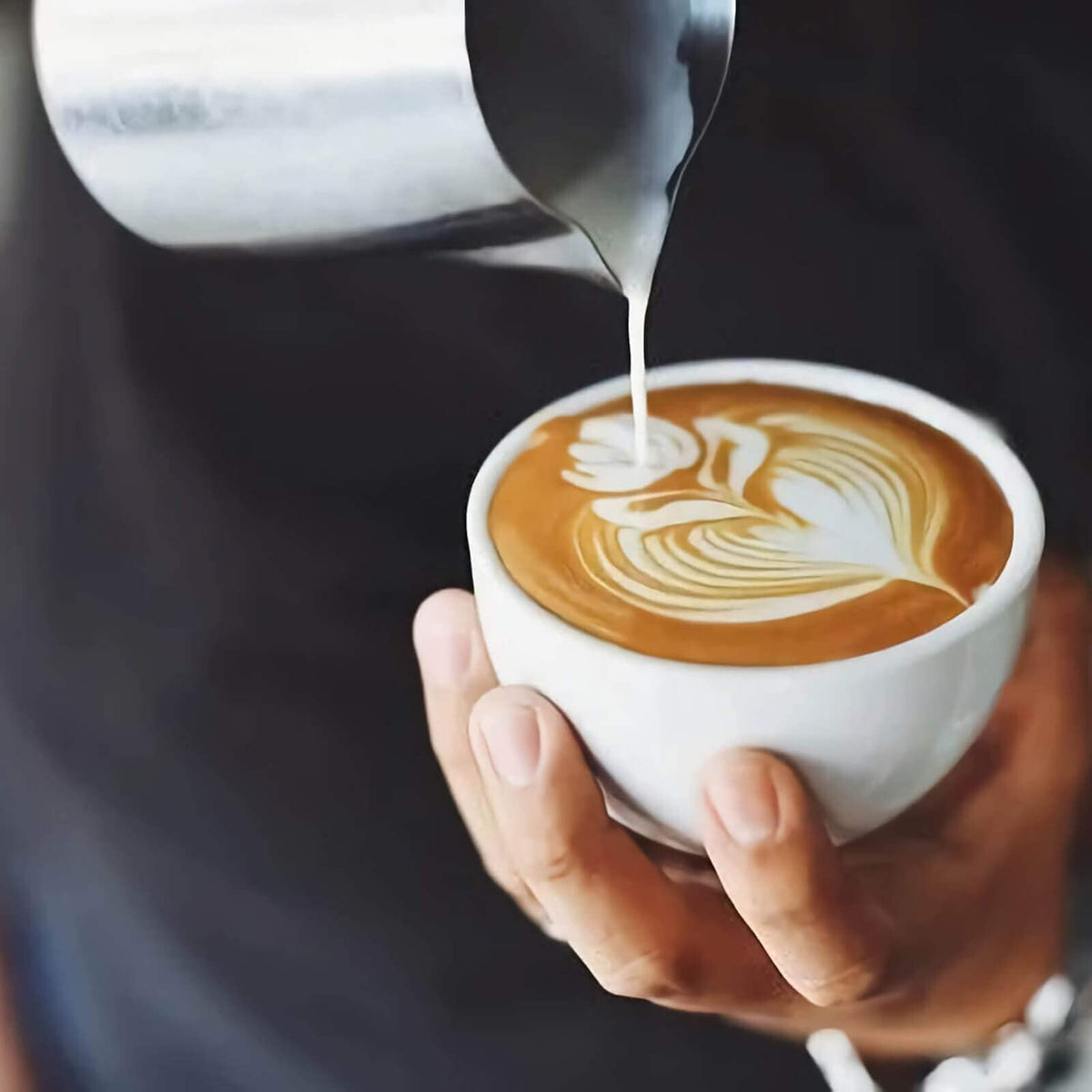 Globotech ergonomic-handle milk pitcher keeps hands cool during frothing