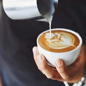 Globotech ergonomic-handle milk pitcher keeps hands cool during frothing