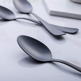 GoGeiLi matte black spoons on a modern table setting for stylish dining